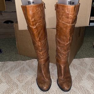 Brown distressed knee-high leather heel boots by Sofft